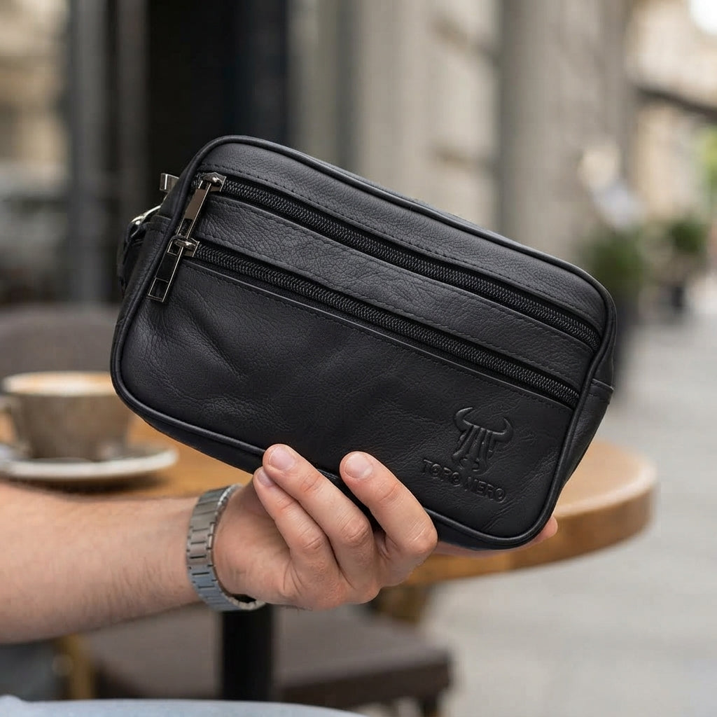 Bolso de piel natural negra para hombre. Para llevar en la mano o en el cinturón.